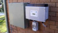 The Sunny Boy 1100 inverter is mounted next to our existing meter box.